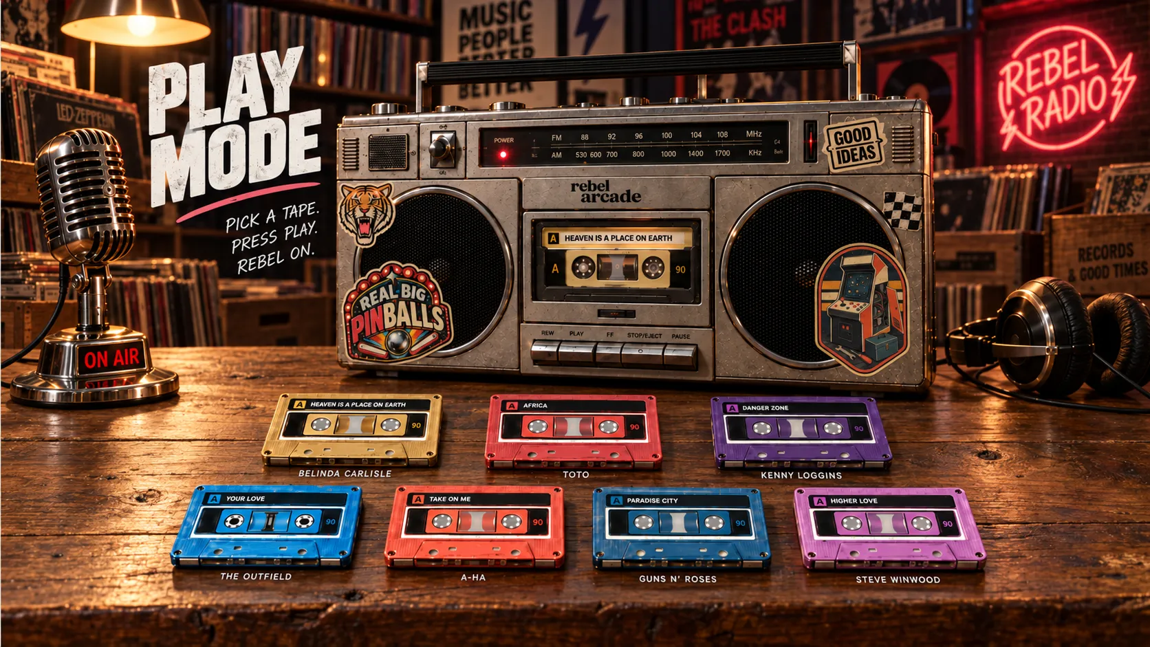 Play Mode: a Rebel Arcade boombox on a wooden table in a record shop, under a Rebel Radio neon sign, with seven coloured cassettes laid out in front of it.