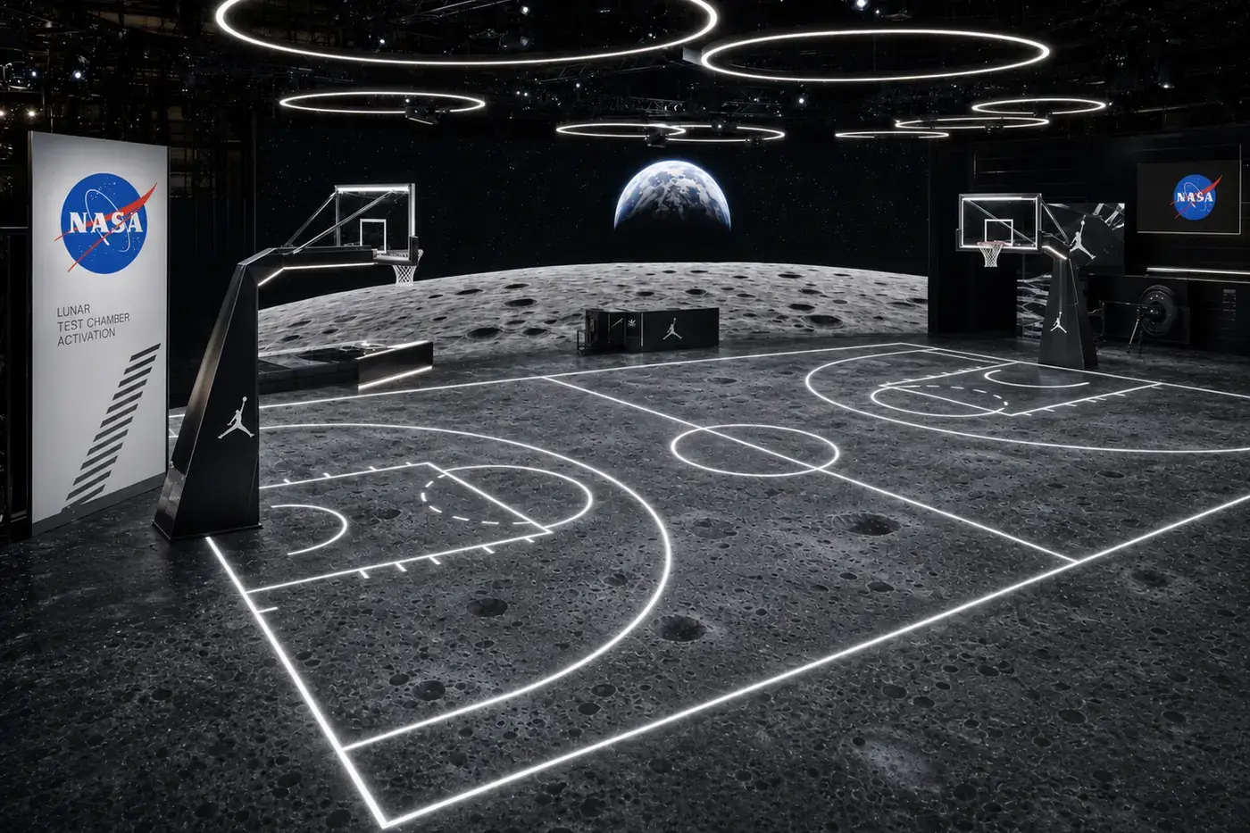 NASA &times; Jordan Jumpman Lunar: a full basketball court built on a lunar surface, ringed by suspended light halos, with Earth rising on the back wall and a NASA Lunar Test Chamber Activation panel at the side.